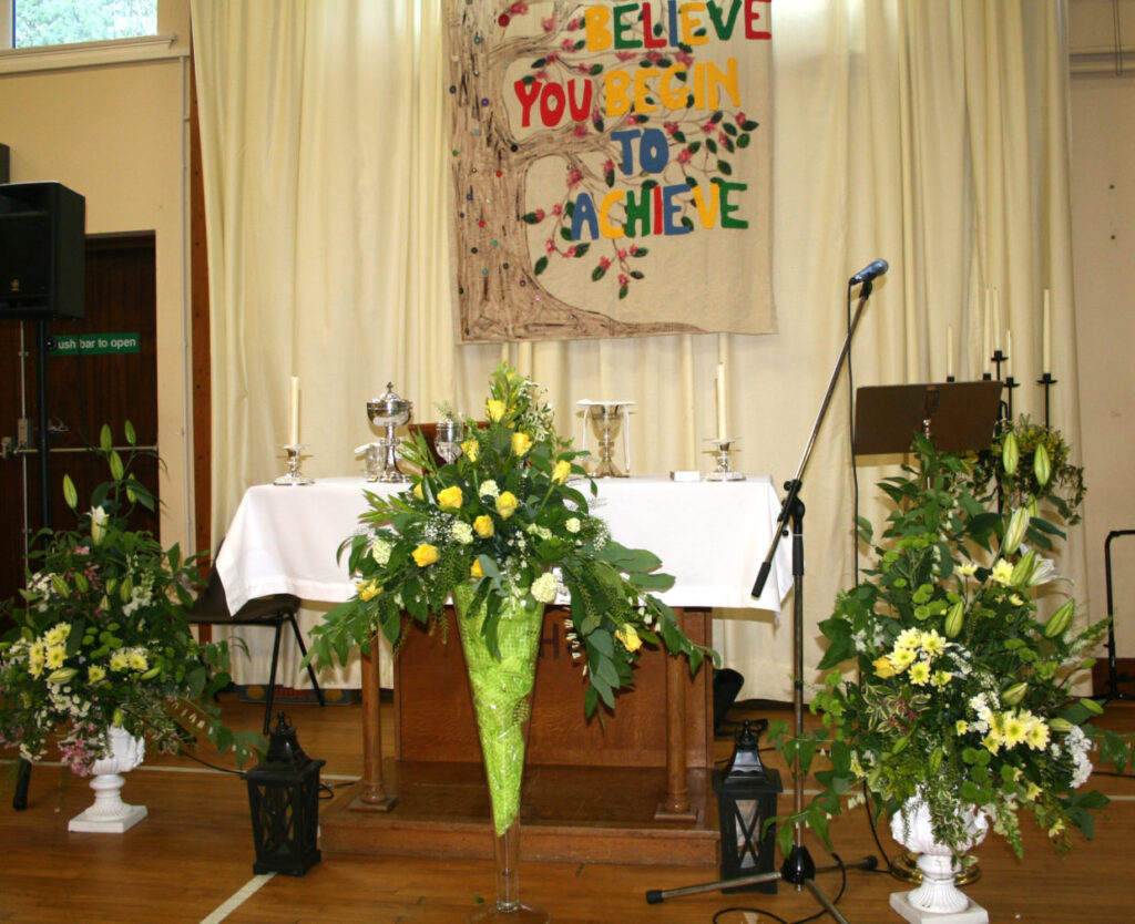 This photograph represents the tranquillity and serenity of our beautifully prepared alters, hanging tapestry, and floral arrangements, prior to the commencement of our Graduation Mass.