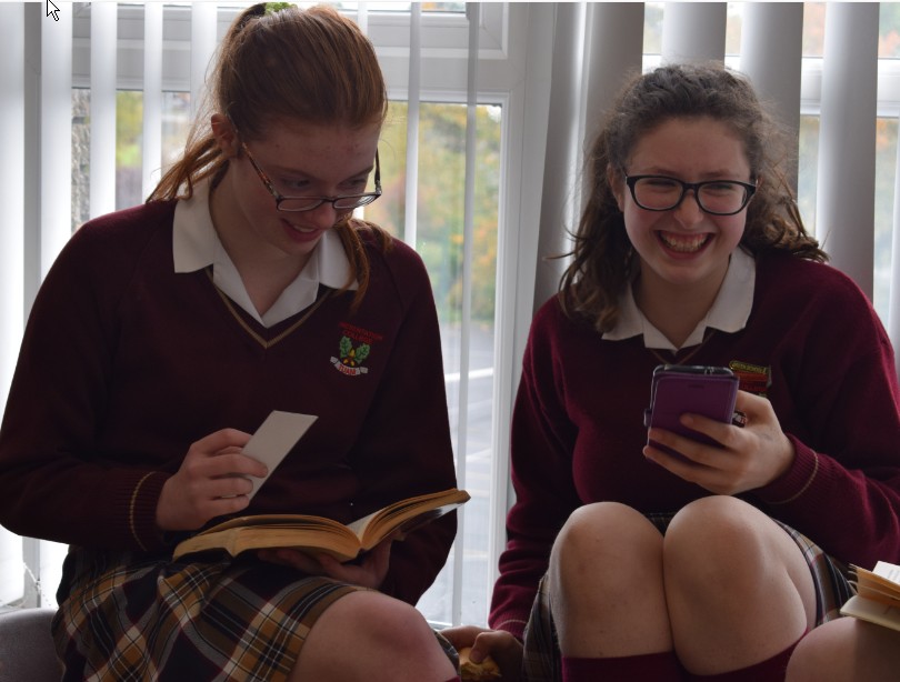 The girls enjoying their books and discussing the book's genre, themes and their favourite characters.